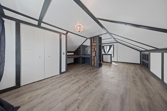 bonus room with wood finished floors
