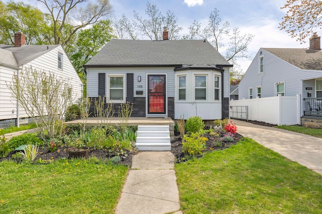 view of front of home with a chimney and driveway