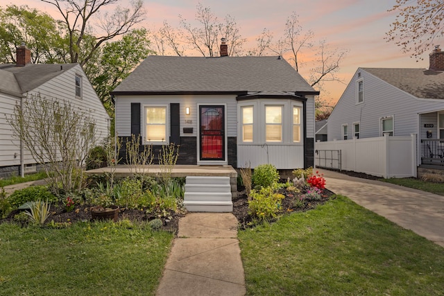 view of front of home featuring a chimney