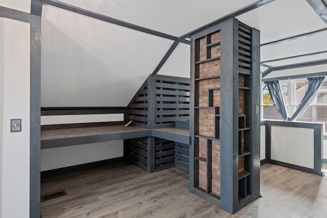 wine cellar featuring wood finished floors and a relaxing sauna