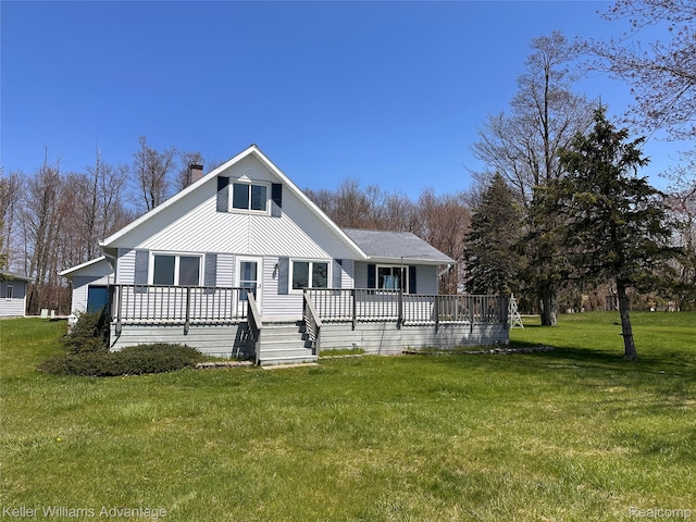 2800 E Booth Rd, Au Gres, MI 48703 - view of front of home with a chimney, a front yard, and a wooden deck