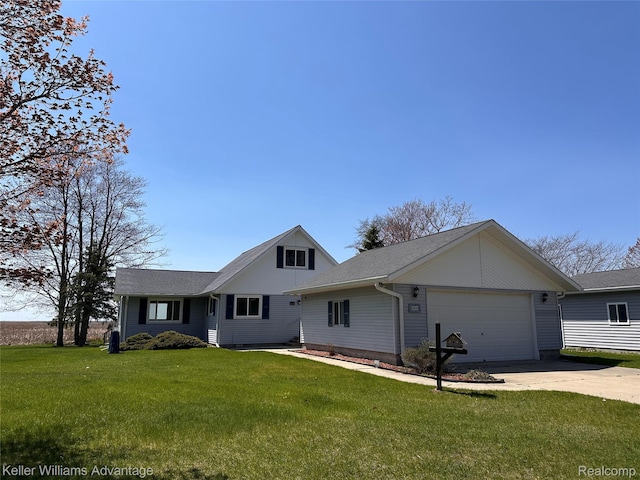 2800 E Booth Rd, Au Gres, MI 48703 - view of front of property featuring an attached garage, concrete driveway, and a front lawn