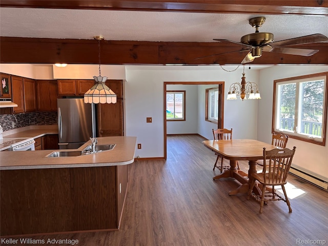 2800 E Booth Rd, Au Gres, MI 48703 - kitchen featuring freestanding refrigerator, a sink, white electric range oven, wood finished floors, and under cabinet range hood