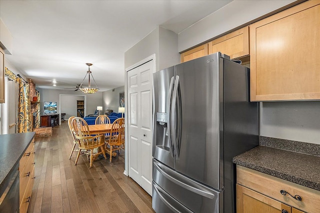 25455 Buckminster Dr, Novi, MI 48375 - kitchen with stainless steel fridge, dark countertops, dark wood-style floors, open floor plan, and pendant lighting