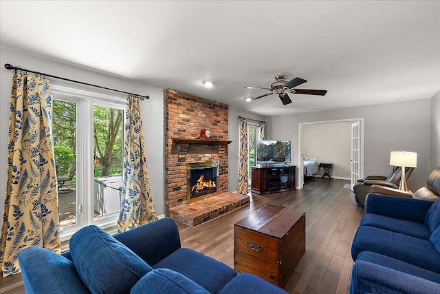 25455 Buckminster Dr, Novi, MI 48375 - living area featuring plenty of natural light, a ceiling fan, a fireplace, and wood-type flooring