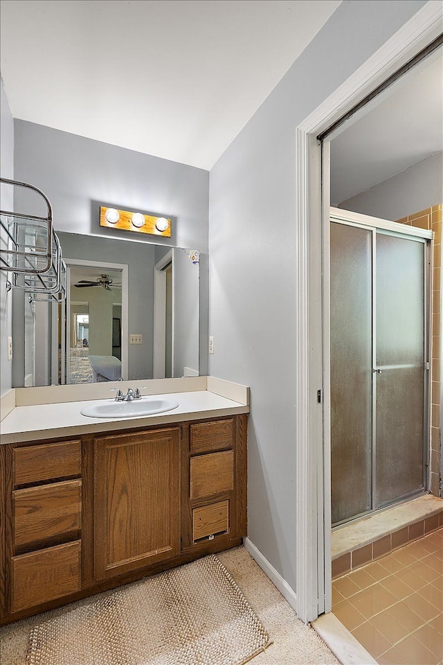 25455 Buckminster Dr, Novi, MI 48375 - ensuite bathroom featuring a stall shower, ceiling fan, vanity, and baseboards