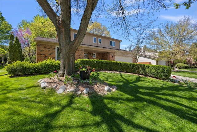 25455 Buckminster Dr, Novi, MI 48375 - view of front of home featuring brick siding, a garage, and a front lawn