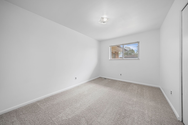 13488 Kingsville Dr, Sterling Heights, MI 48312 - carpeted empty room featuring baseboards