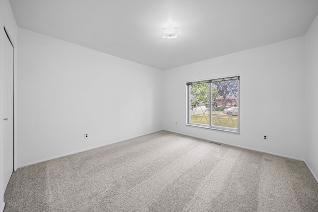 13488 Kingsville Dr, Sterling Heights, MI 48312 - empty room featuring light colored carpet and baseboards