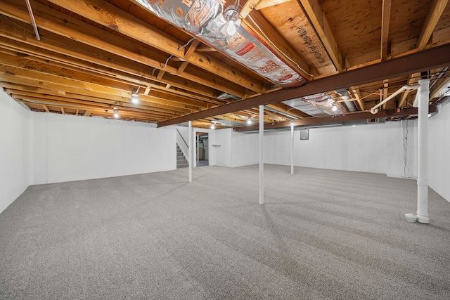 13488 Kingsville Dr, Sterling Heights, MI 48312 - below grade area featuring stairway and carpet floors