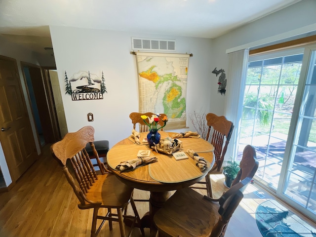 9612 Clubhouse Dr W, Canadian Lakes, MI 49346 - dining room with wood finished floors