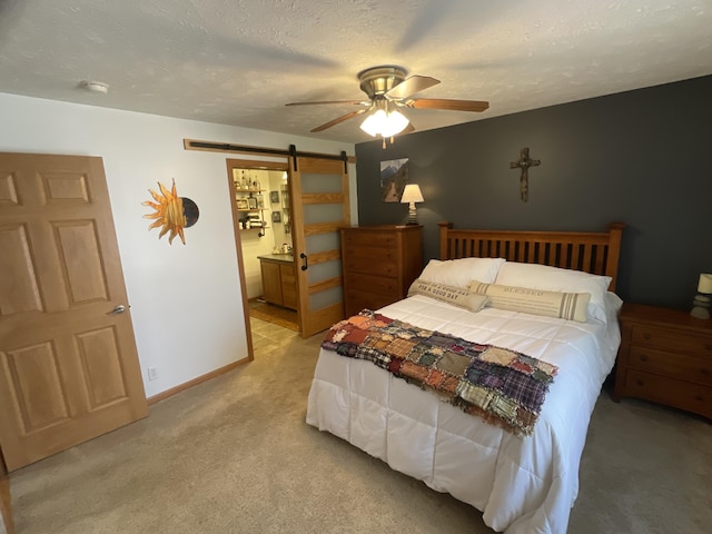 9612 Clubhouse Dr W, Canadian Lakes, MI 49346 - bedroom with a barn door, light carpet, a ceiling fan, and ensuite bathroom