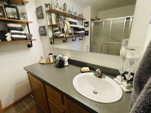 9612 Clubhouse Dr W, Canadian Lakes, MI 49346 - full bathroom with a stall shower, vanity, and tile patterned flooring