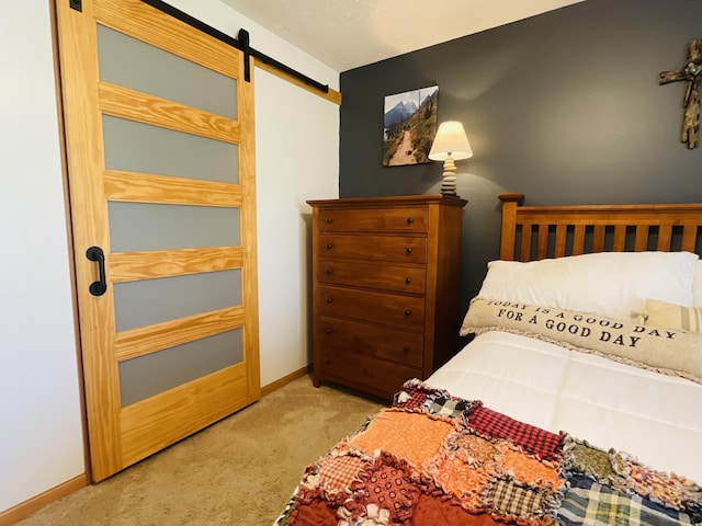 9612 Clubhouse Dr W, Canadian Lakes, MI 49346 - bedroom with carpet flooring, a barn door, and baseboards