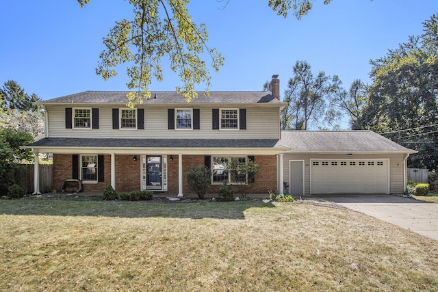 2021 Skyler Dr, Kalamazoo, MI 49008 - view of front of home featuring a chimney, a garage, driveway, and brick siding