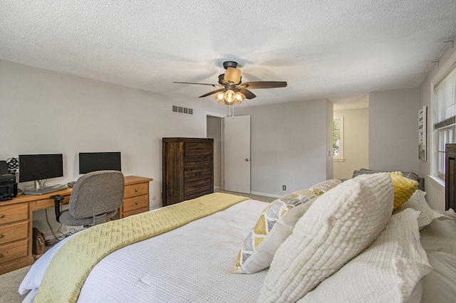 2021 Skyler Dr, Kalamazoo, MI 49008 - bedroom featuring a desk, a textured ceiling, and ceiling fan
