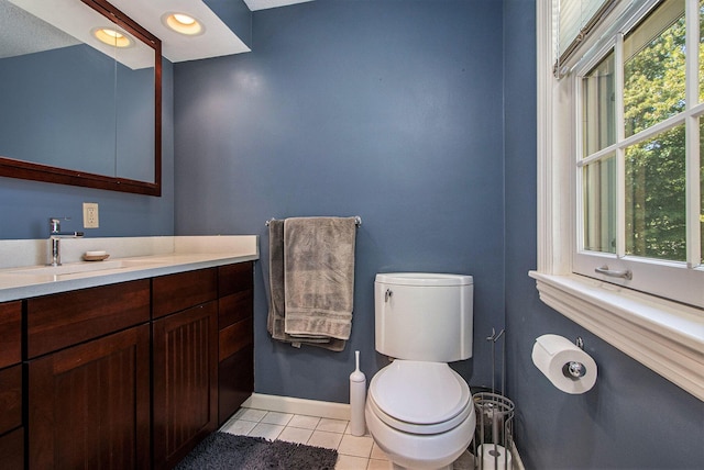 2021 Skyler Dr, Kalamazoo, MI 49008 - bathroom featuring tile patterned flooring, toilet, radiator, baseboards, and vanity