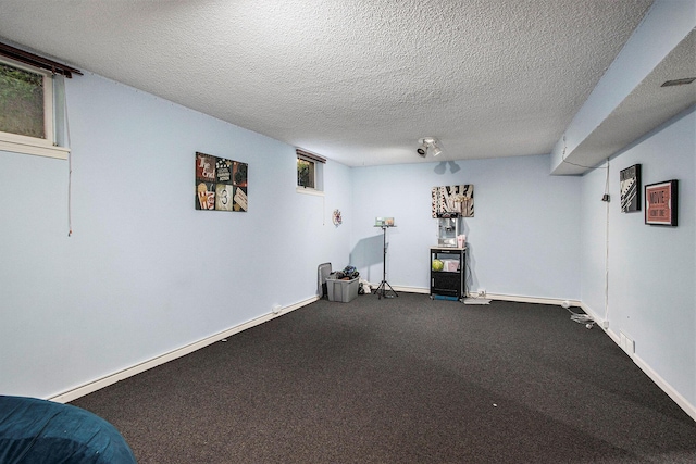 2021 Skyler Dr, Kalamazoo, MI 49008 - finished basement featuring a textured ceiling, baseboards, and carpet flooring