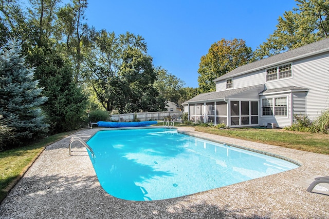 2021 Skyler Dr, Kalamazoo, MI 49008 - view of swimming pool featuring a sunroom and fence