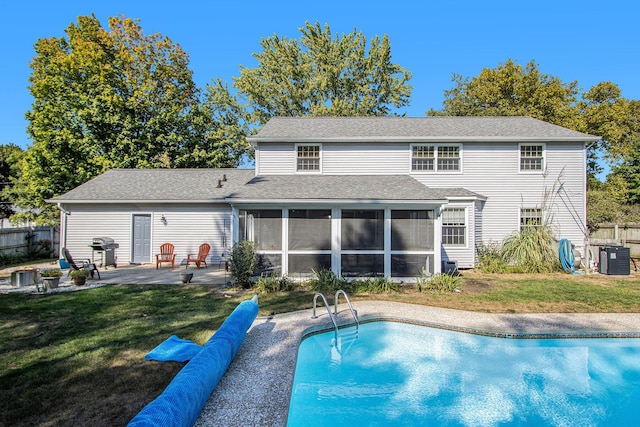 2021 Skyler Dr, Kalamazoo, MI 49008 - back of house with a sunroom, a patio area, and cooling unit