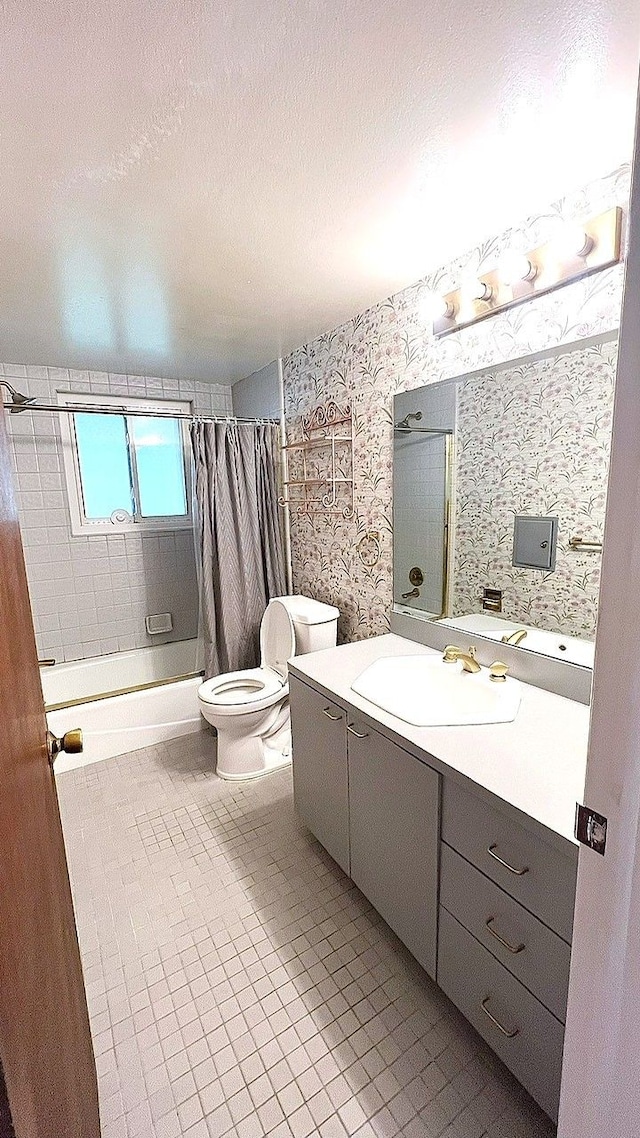 full bathroom with wallpapered walls, toilet, shower / tub combo, vanity, and tile patterned floors