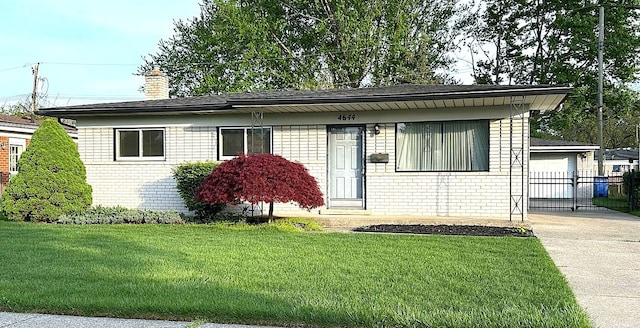 view of front of property featuring a chimney, brick siding, and concrete driveway