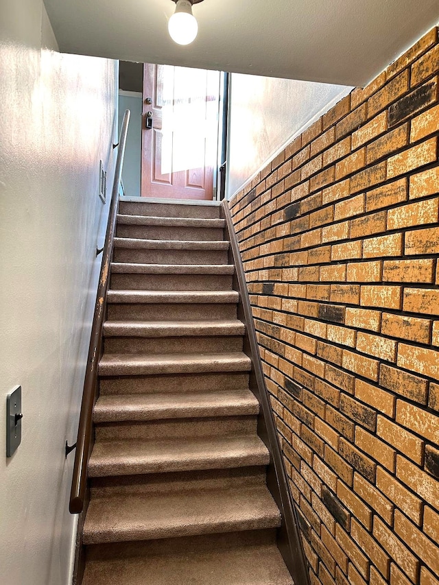 stairs with brick wall