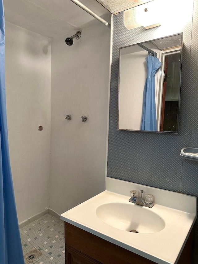 full bath featuring vanity and curtained shower