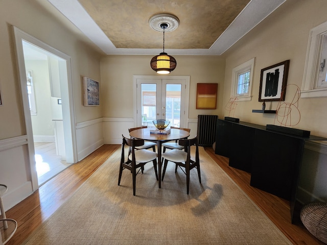 2414 Yale Ave, Royal Oak, MI 48067 - dining space with a raised ceiling, light wood finished floors, healthy amount of natural light, and french doors