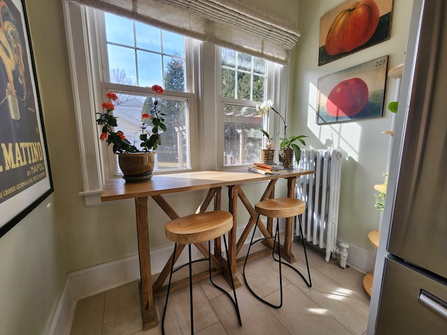 2414 Yale Ave, Royal Oak, MI 48067 - dining space featuring radiator heating unit, baseboards, and tile patterned flooring