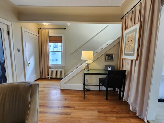 2414 Yale Ave, Royal Oak, MI 48067 - foyer with radiator heating unit, stairs, and light wood-type flooring