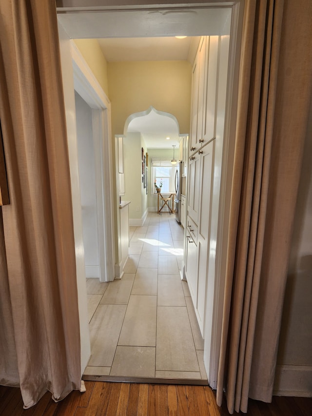 2414 Yale Ave, Royal Oak, MI 48067 - hall with arched walkways and light tile patterned floors