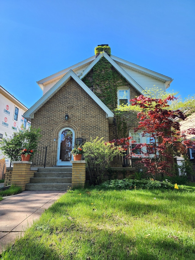 2414 Yale Ave, Royal Oak, MI 48067 - tudor house with brick siding and a chimney
