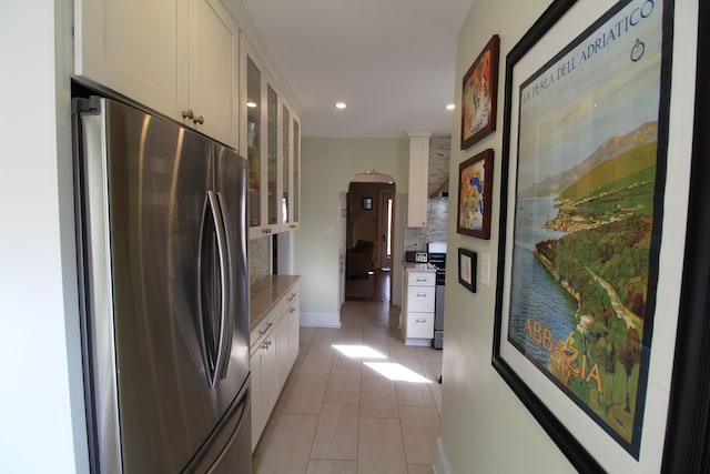 2414 Yale Ave, Royal Oak, MI 48067 - kitchen with appliances with stainless steel finishes, light tile patterned floors, white cabinetry, glass insert cabinets, and recessed lighting