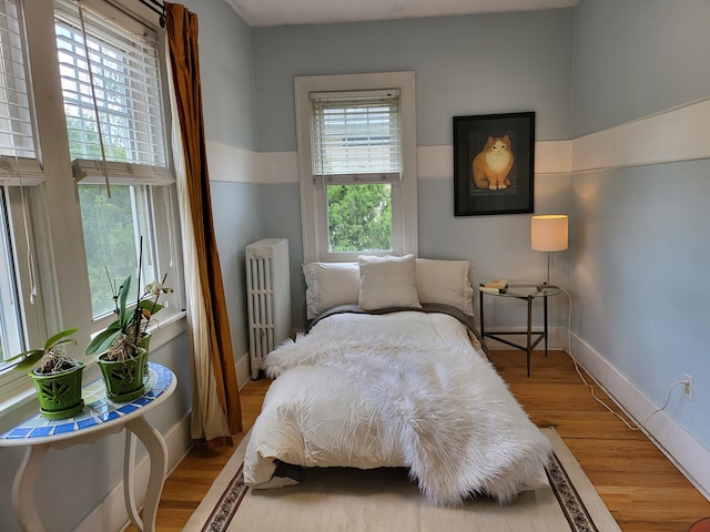 2414 Yale Ave, Royal Oak, MI 48067 - bedroom featuring radiator, wood finished floors, and baseboards