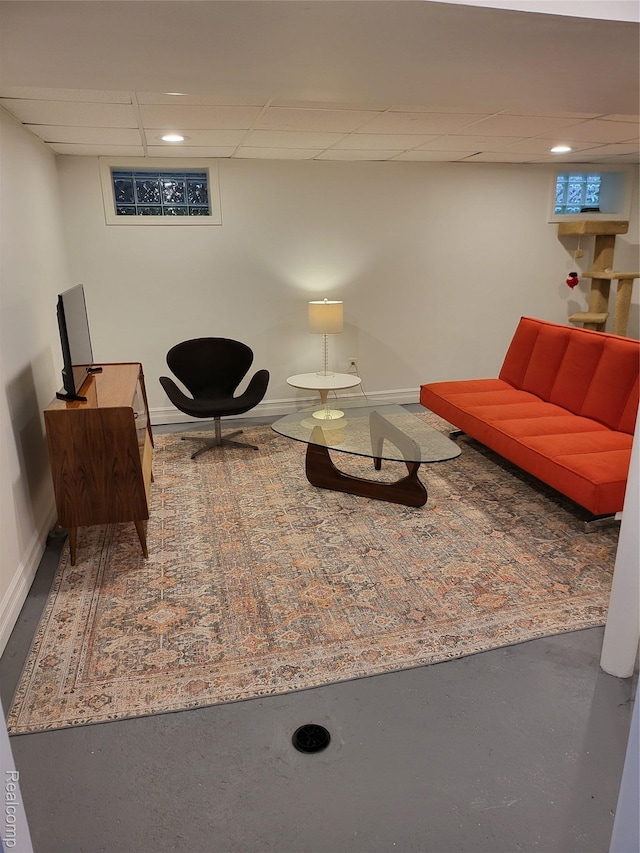 2414 Yale Ave, Royal Oak, MI 48067 - sitting room with a drop ceiling, baseboards, and finished concrete flooring