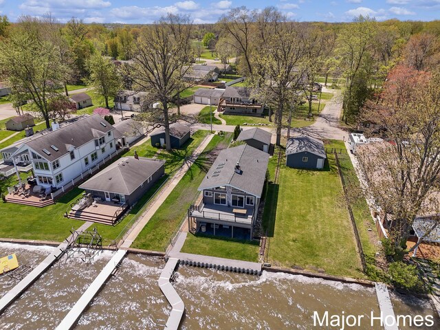aerial perspective of suburban area with a large body of water