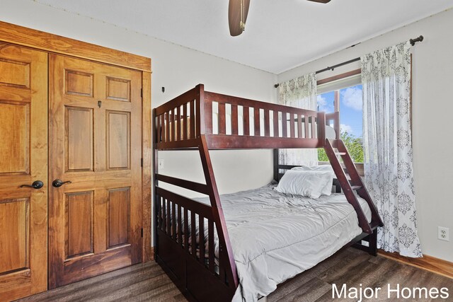 bedroom featuring wood finished floors and baseboards