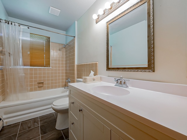 bathroom with shower / bath combination with curtain, vanity, toilet, baseboard heating, and tile patterned floors