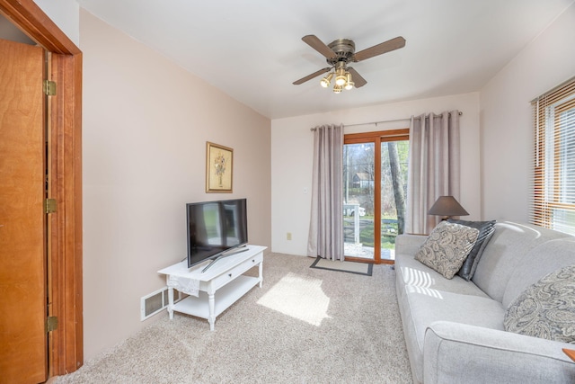 10401 N Chippewa Dr, Evart, MI 49631 - living room with carpet and ceiling fan