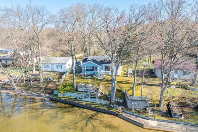 10401 N Chippewa Dr, Evart, MI 49631 - dock area with a water view and a yard