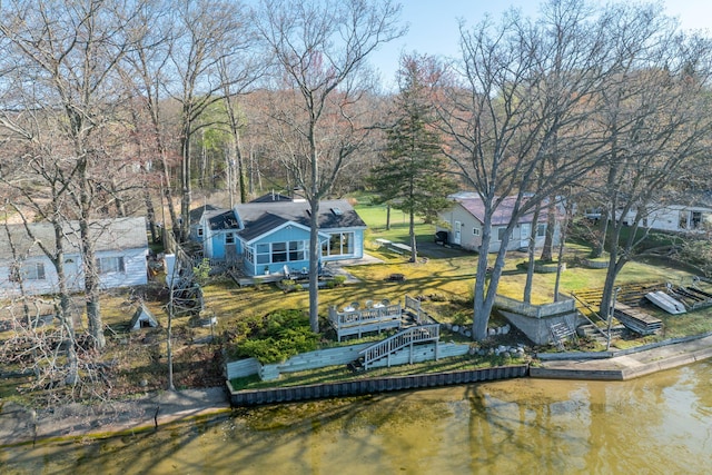 10401 N Chippewa Dr, Evart, MI 49631 - dock featuring a deck with water view and a yard