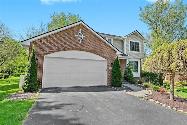 3645 Sandbar Dr, Commerce Twp, MI 48382 - view of front of house with brick siding, asphalt driveway, and an attached garage