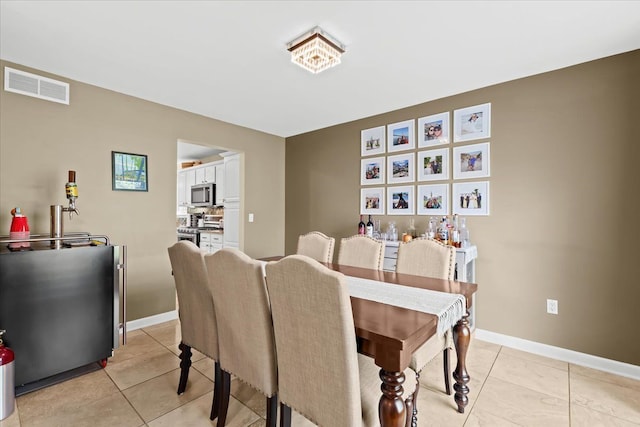 3645 Sandbar Dr, Commerce Twp, MI 48382 - dining area featuring light tile patterned floors and baseboards