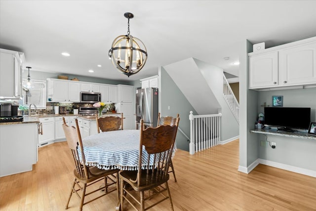 3645 Sandbar Dr, Commerce Twp, MI 48382 - dining area featuring a chandelier, light wood-style flooring, recessed lighting, and baseboards