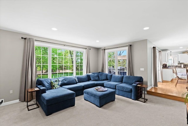 3645 Sandbar Dr, Commerce Twp, MI 48382 - living area with recessed lighting, light colored carpet, and baseboards