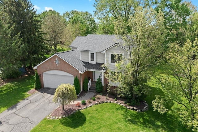 3645 Sandbar Dr, Commerce Twp, MI 48382 - traditional-style house with brick siding, asphalt driveway, a front lawn, a garage, and a shingled roof