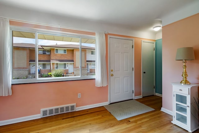 9917 Middlebelt Rd, Livonia, MI 48150 - entrance foyer with baseboards, wood finished floors, and healthy amount of natural light