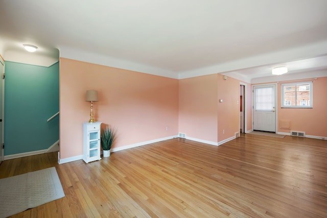 9917 Middlebelt Rd, Livonia, MI 48150 - unfurnished room featuring light wood-style flooring, baseboards, and stairs