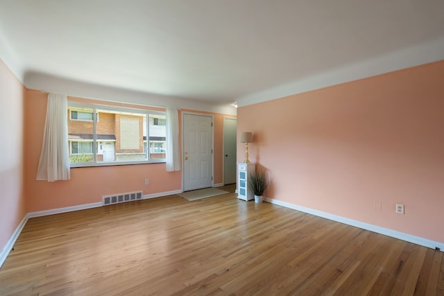 9917 Middlebelt Rd, Livonia, MI 48150 - unfurnished living room featuring wood finished floors and baseboards